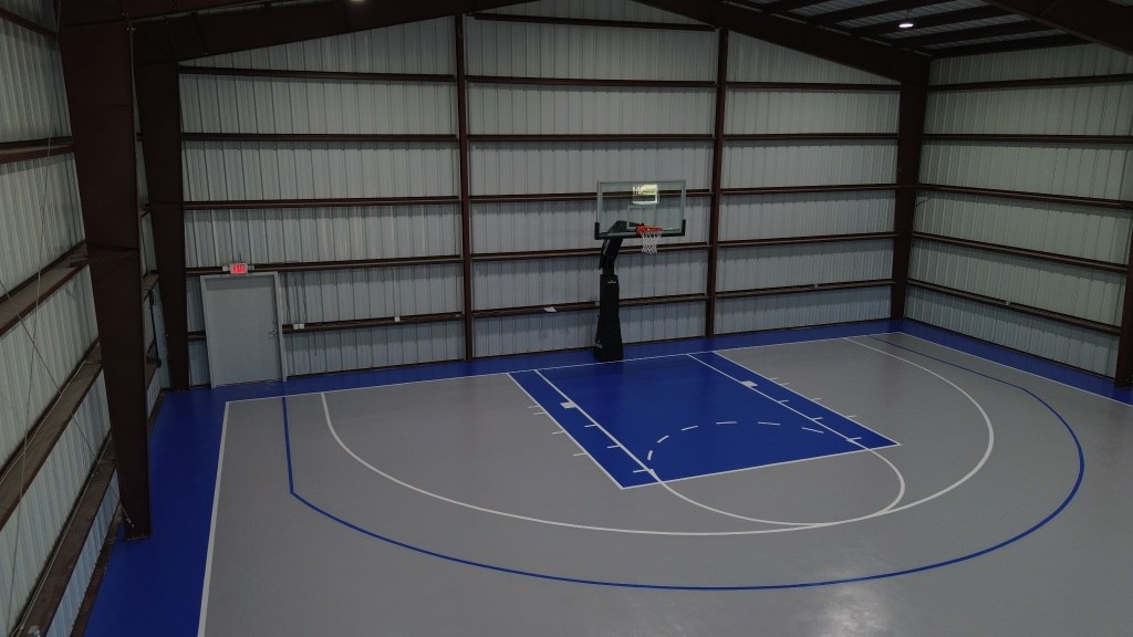 Completed indoor basketball court from a Go Green general contracting project