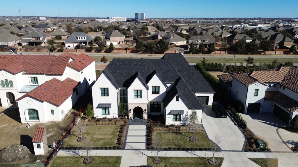 Aerial view of a completed Go Green Roofing residential roof