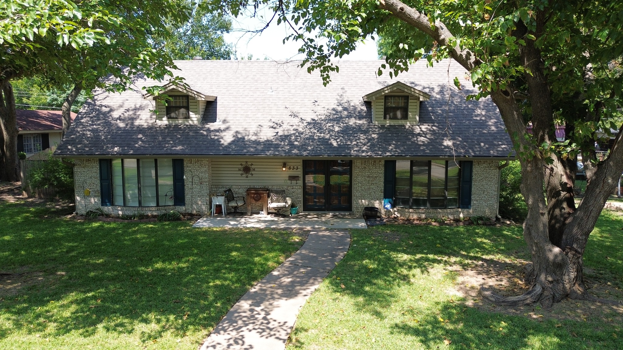 Residential roof project on a tree-lined North Texas home