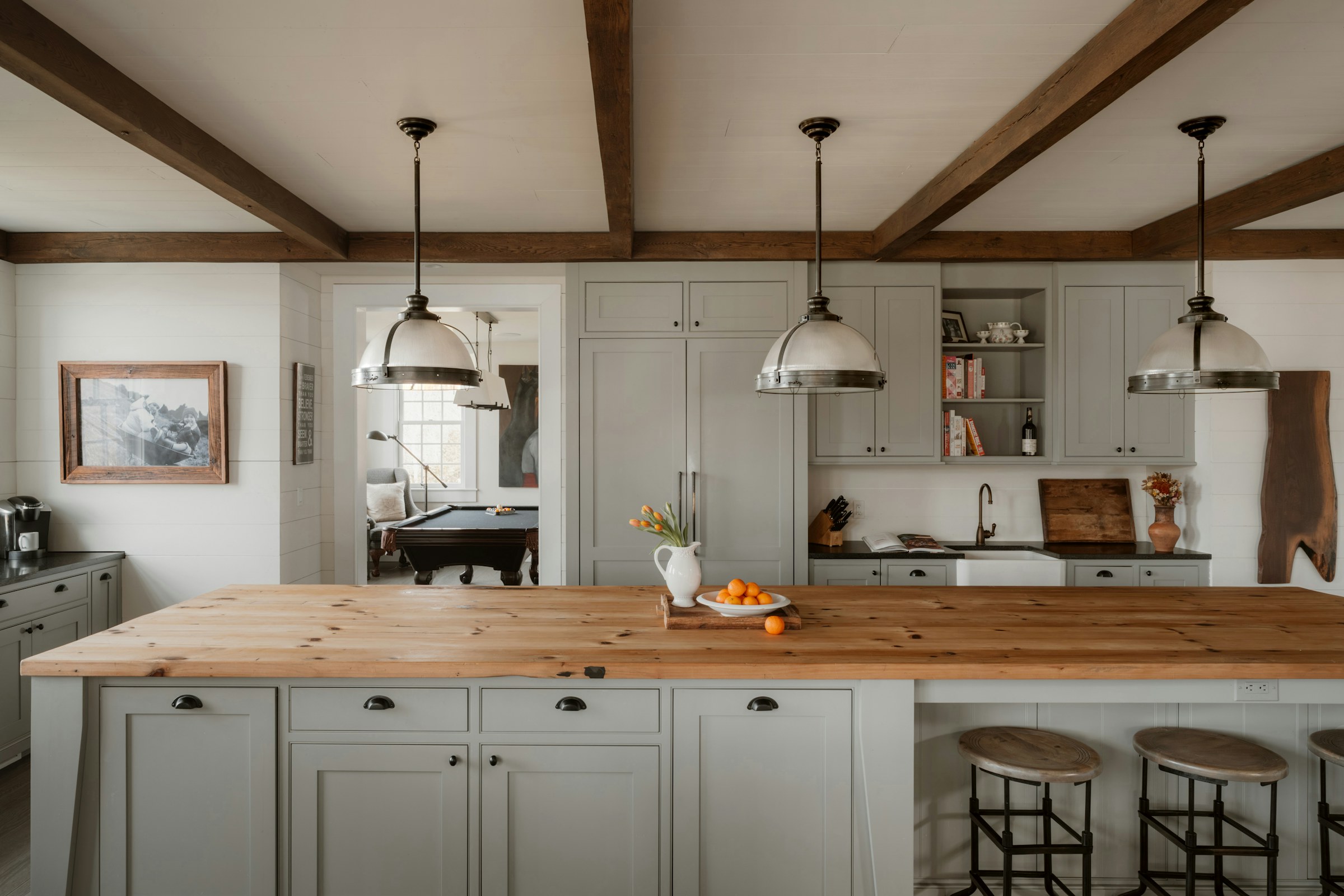 Warm modern kitchen with island and pendant lighting