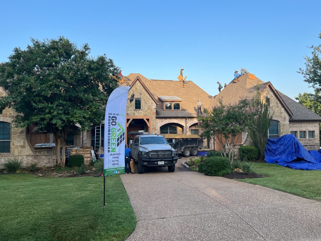 Go Green Roofing crew working on a North Texas home
